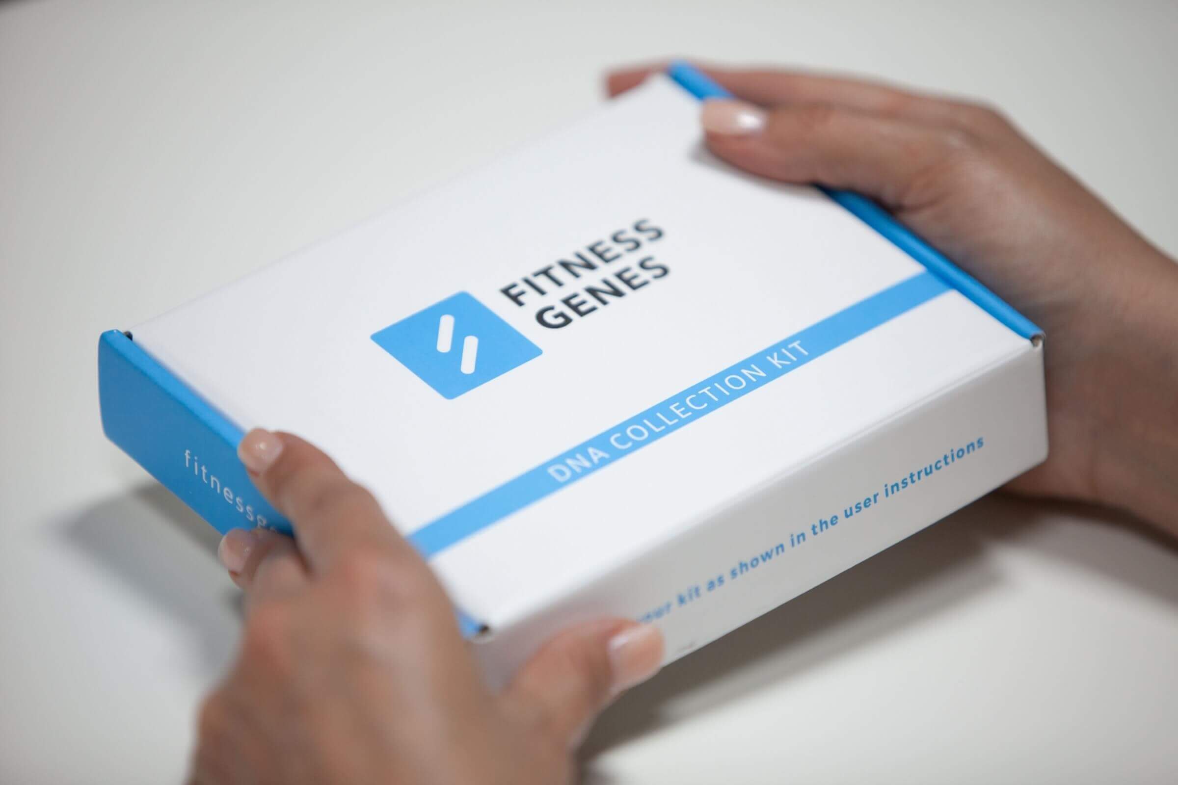 FitnessGenes DNA Collection Kit box held in two hands