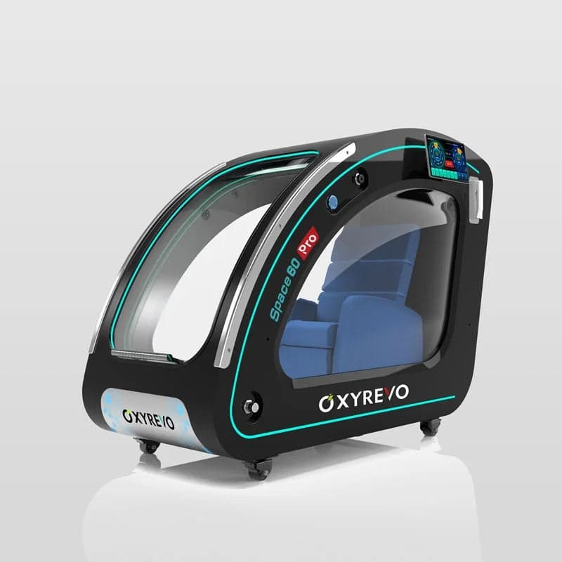 OxyRevo Space60 Pro hard shell sitting hyperbaric chamber in black with a clear front door, side window and recliner seat