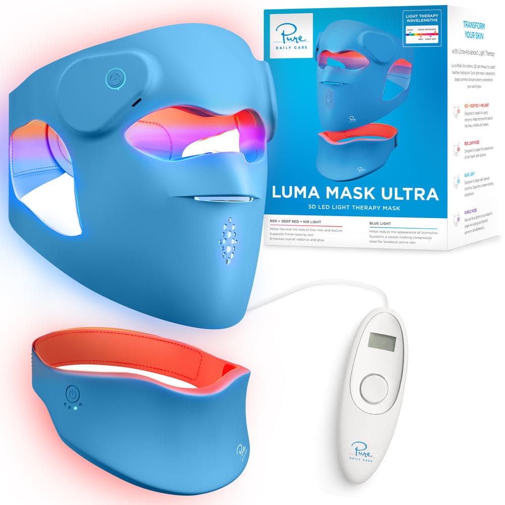 Pure Daily Care Luma Mask Ultra kit: blue silicone full-face LED mask lit red and blue, a matching neck mask, a white handheld controller with a display, and the retail box