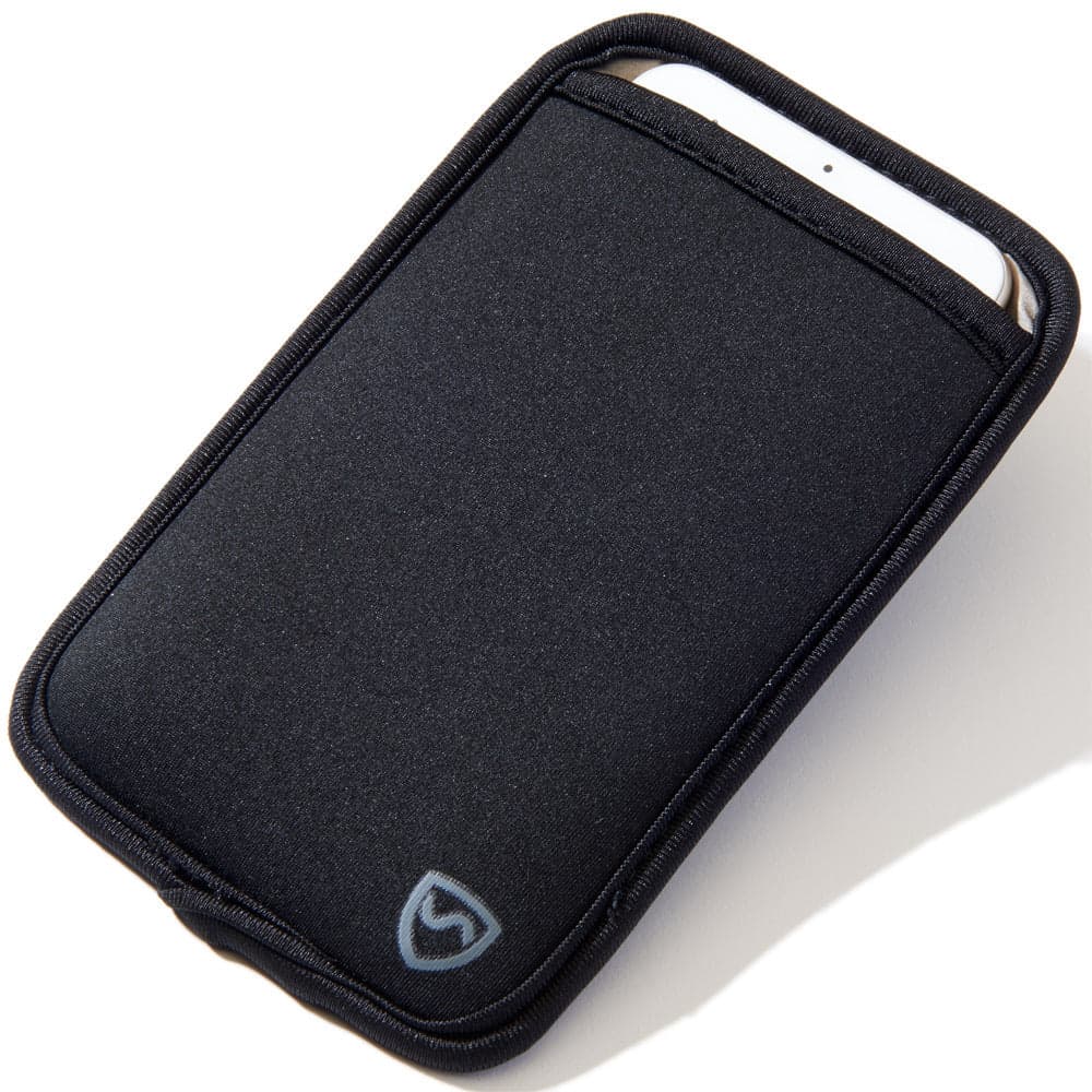 Black neoprene SYB Phone Pouch lying at an angle on a white background, with a white phone partly inserted at the open top and a grey shield logo near the lower corner