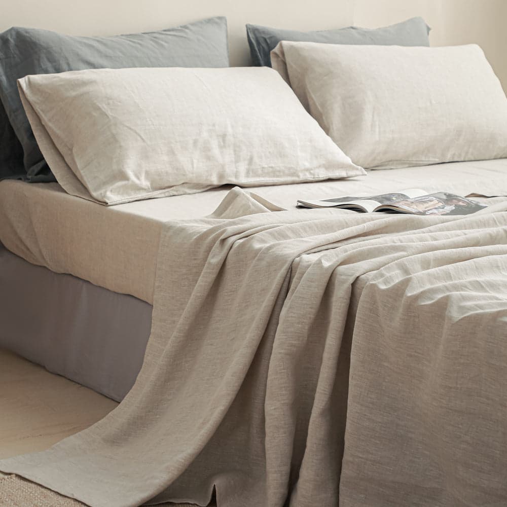 Simple & Opulence French flax linen sheet set on a bed