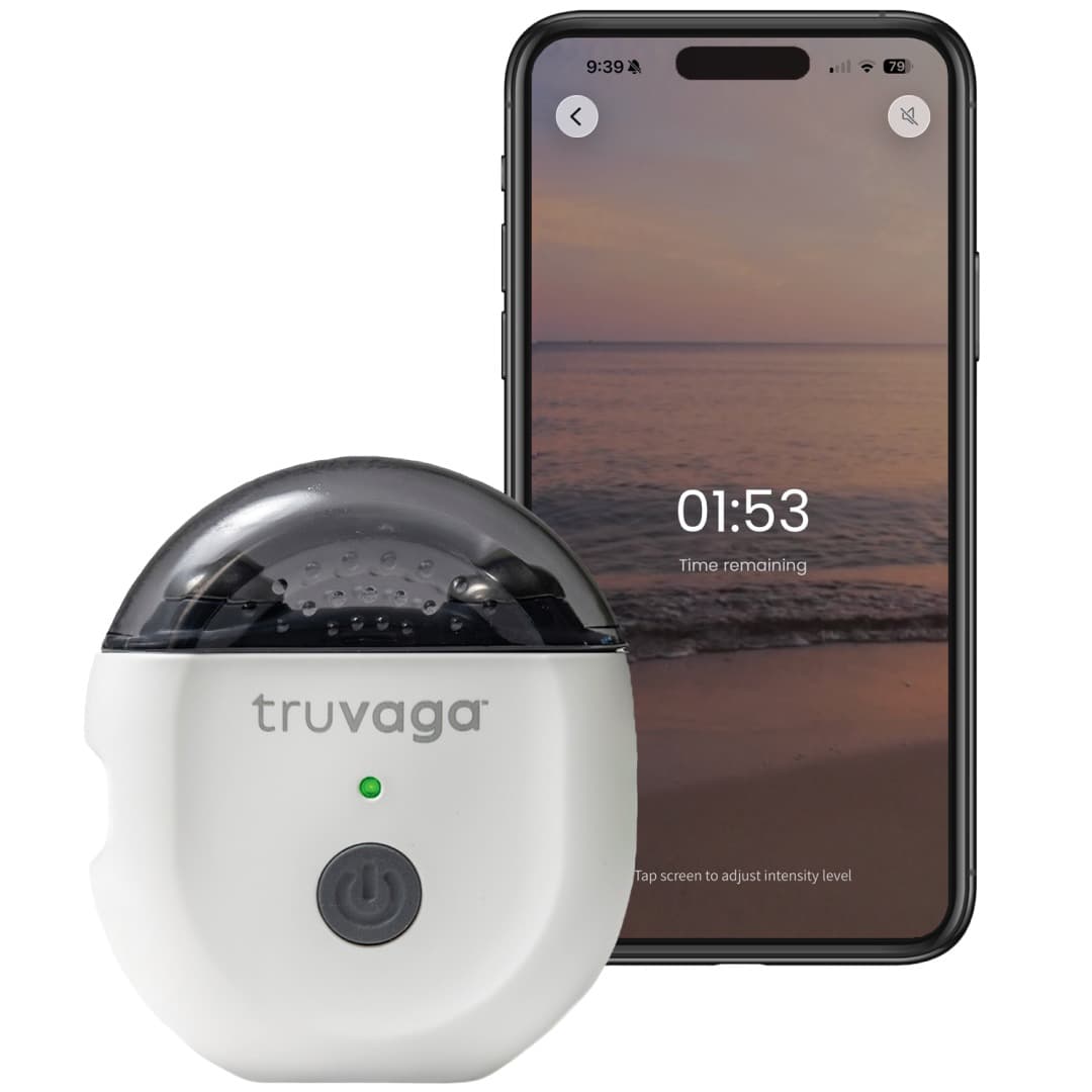White Truvaga Plus handheld stimulator with a dark cap, beside a phone showing the Truvaga Plus app session timer