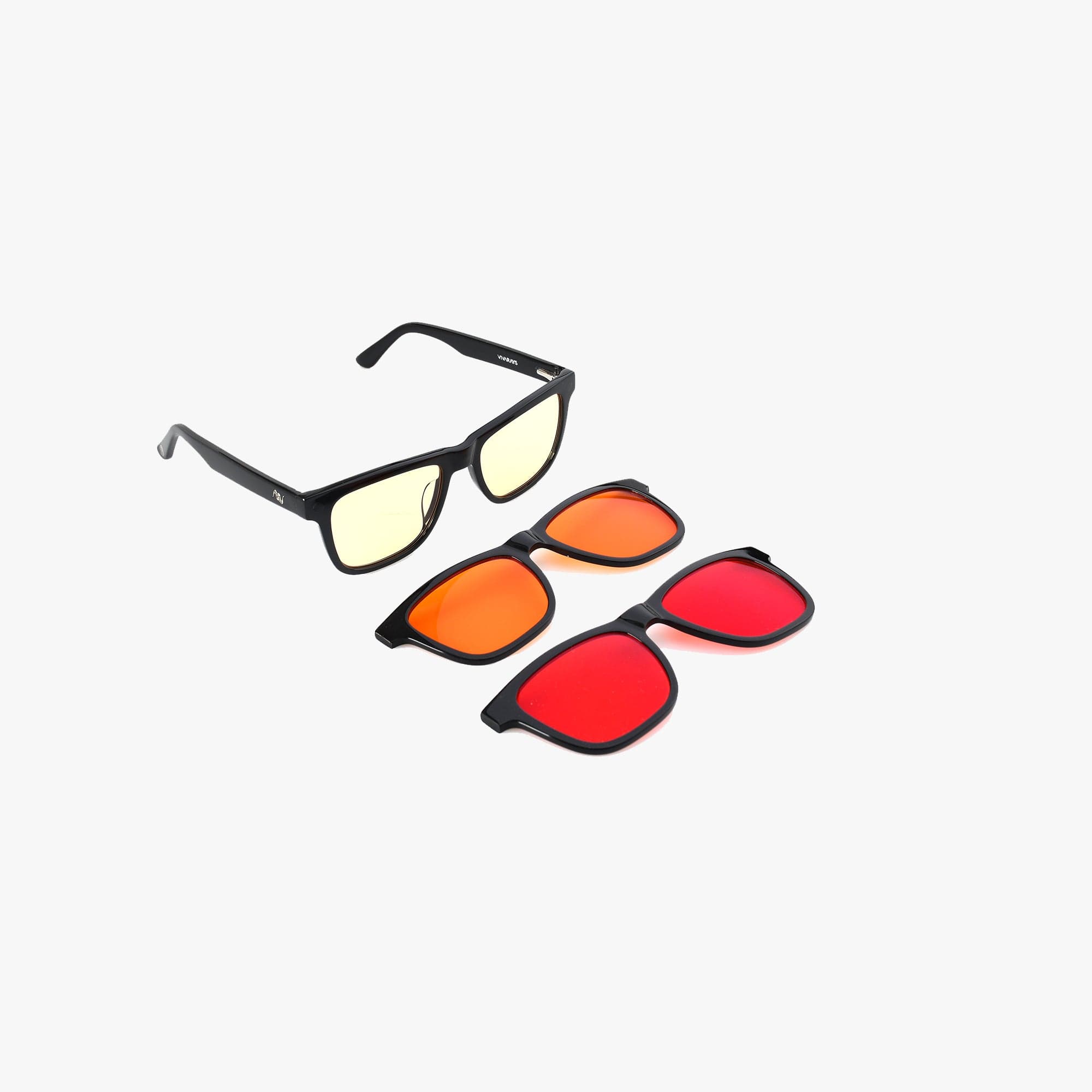 VivaRays Sol Clip'N'Go 3-in-1 black acetate glasses with yellow daytime lenses beside the orange evening and red nighttime magnetic clip-ons on a white background