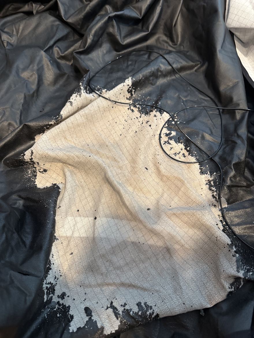 Our old grounding sheet from another brand after more than five years: the coating has cracked and peeled away from the backing