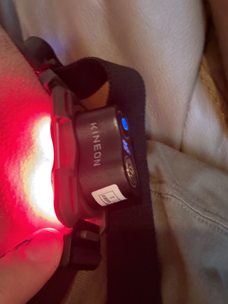 Mid-session: the modules light red against the skin